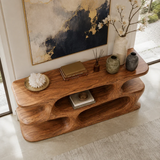 Narrow console table with layered shelving for refined foyer decor and storage indoors