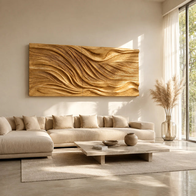 Horizontal wall art with layered carved waves adds depth above a modern living room sofa