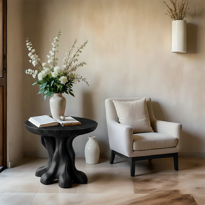 With its black color finish, the side table blends organic curves and contemporary design