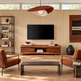 Designed as a TV stand with storage, this natural solid wood piece feels warm indoors