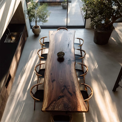 Live edge dark wood dining table with natural grain, modern minimalist dining space top view