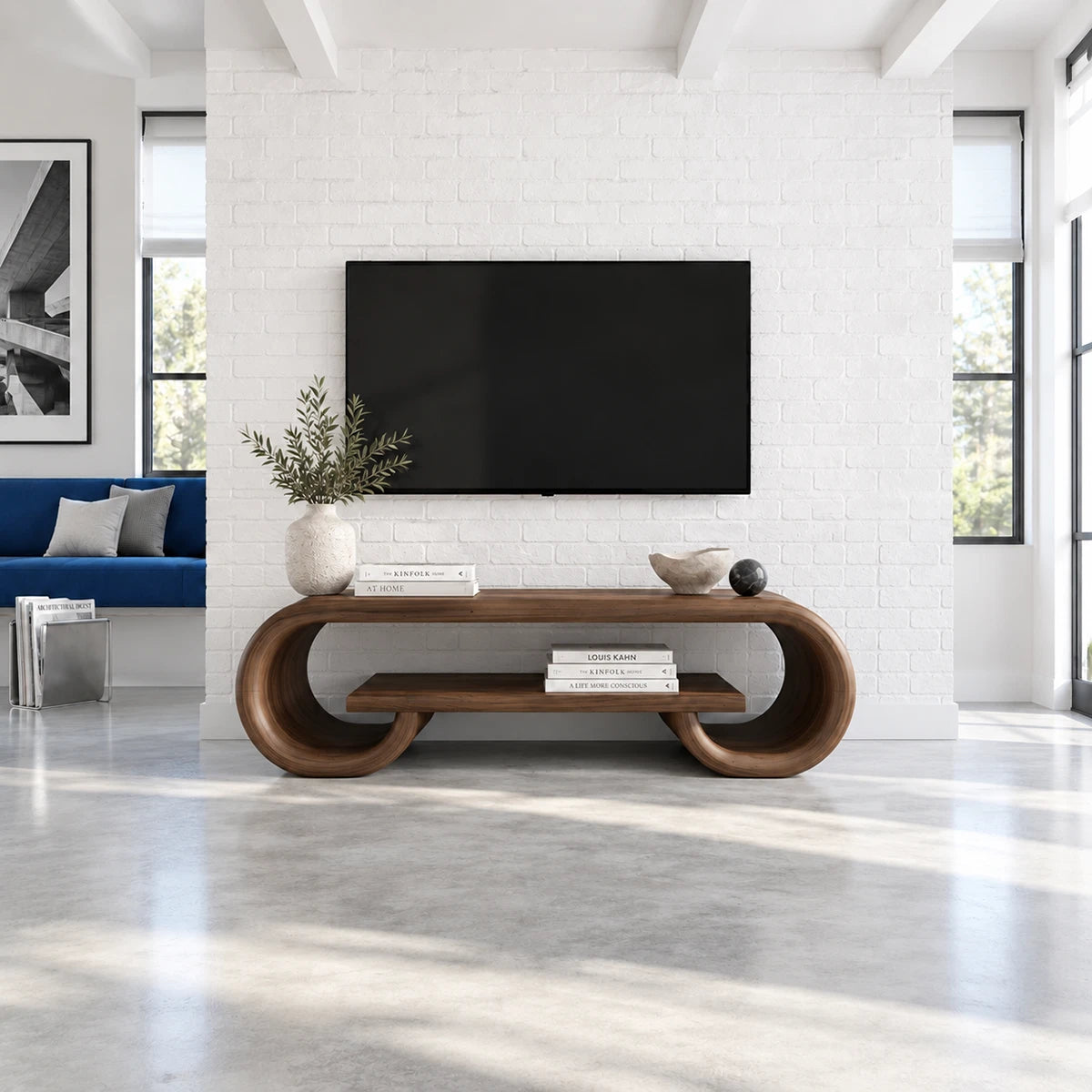 Living room media console in solid wood with curved framing and display shelving
