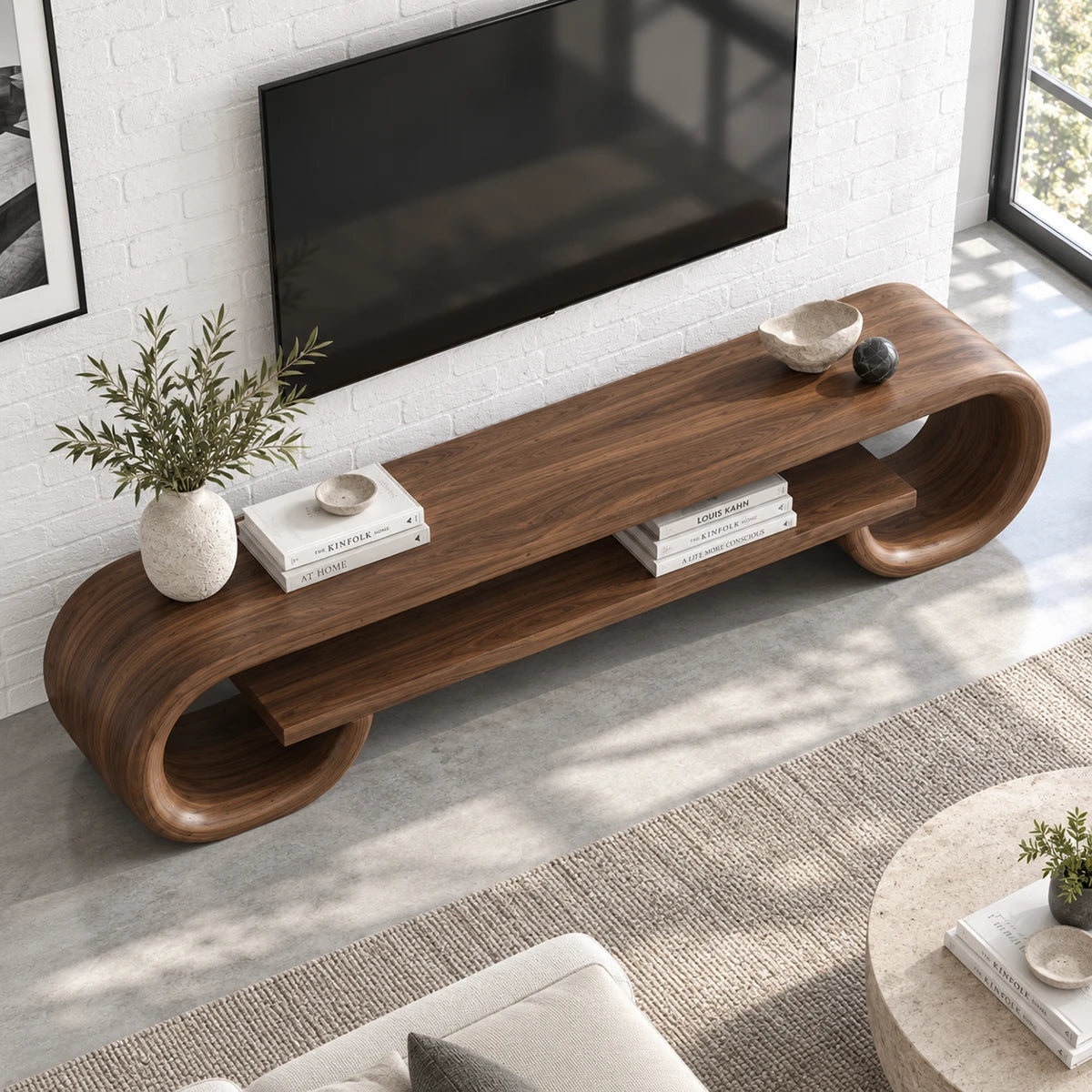 Curved media stand in solid wood with looped legs and an open shelf for decor display
