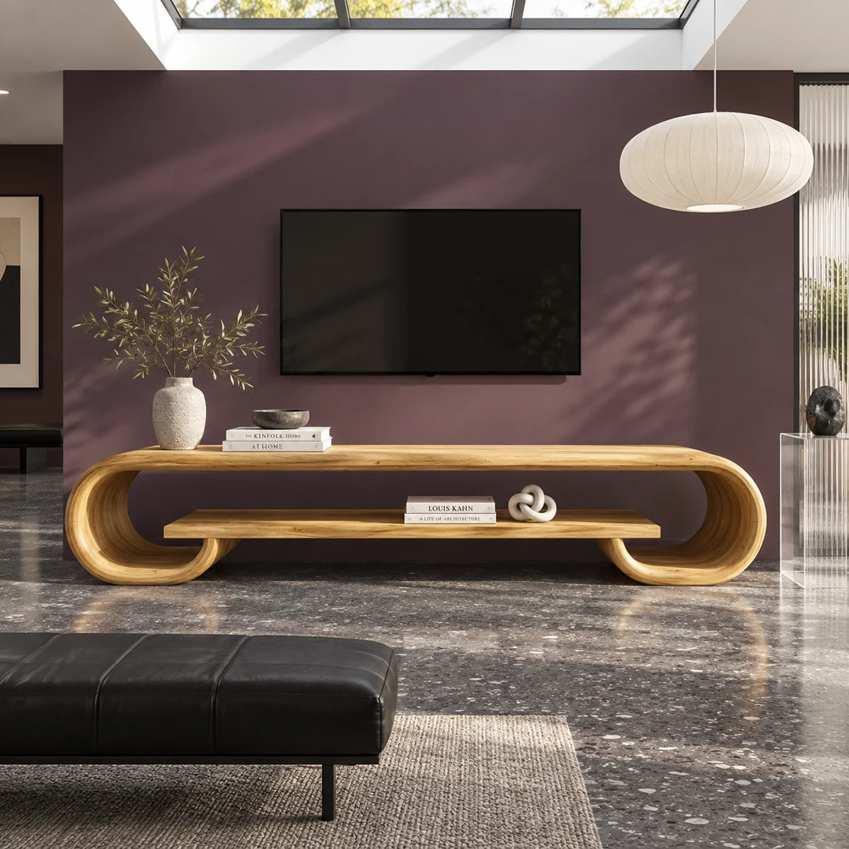 Designer entertainment unit in solid wood with sculpted curves and open storage
