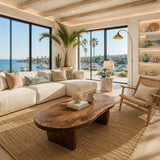 Organic coffee table with thick sculpted legs and a broad freeform solid wood top