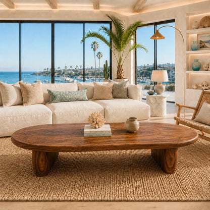 Coastal coffee table with smooth organic contours and a handcrafted solid wood base