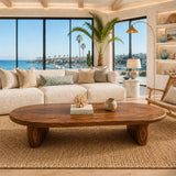 Coastal coffee table with smooth organic contours and a handcrafted solid wood base