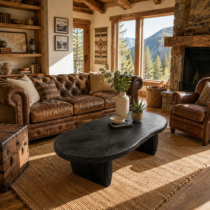Contemporary coffee table with flowing edges and substantial solid wood leg construction