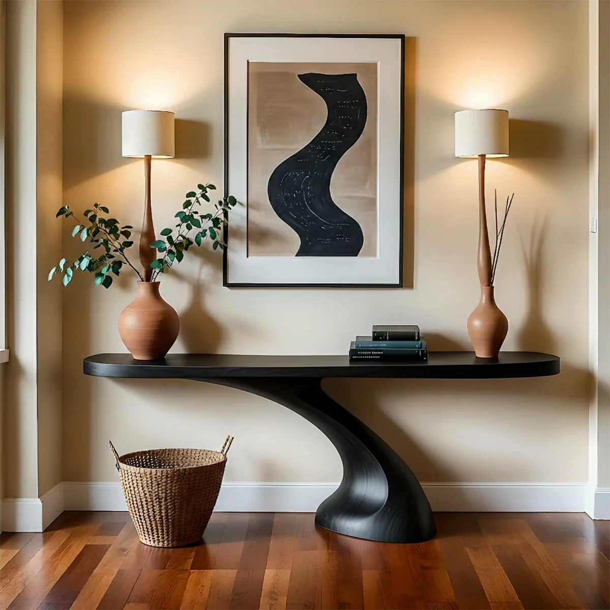 This entry space highlights a sculptural wood console table with natural grain and smooth finish