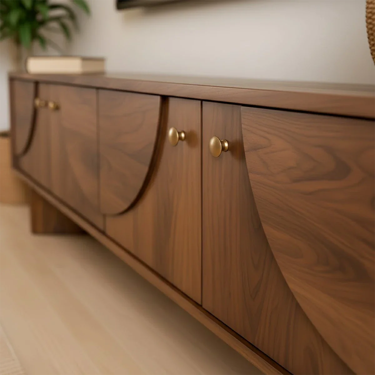 Modern TV stand in soft brown finish with smooth surface and low profile in a bright interior