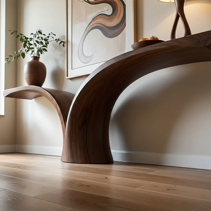 In this stylish interior, a curved wood console table creates a bold sculptural focal point