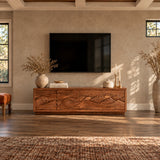 Functional media unit in solid wood with artistic relief doors and roomy interior
