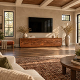 Modern media console in solid wood with scenic front panels and low wide storage
