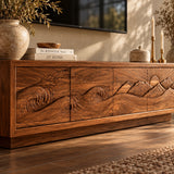 Low-profile TV console in solid wood with wave motif and mountain scene carving detail
