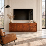 Functional media unit in solid wood with carved scenic doors and generous storage space
