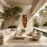 Abstract wall art with flowing cutouts creates a bold focal point in an open living space