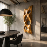 Modern wall sculpture with sweeping cutouts brings artistic depth to a spacious interior