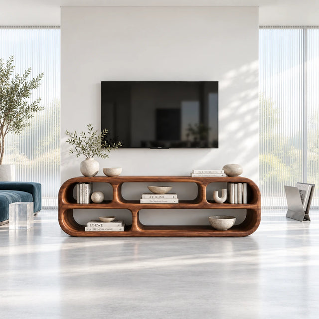 Sculptural TV stand in solid wood with rounded open shelves and low modern profile
