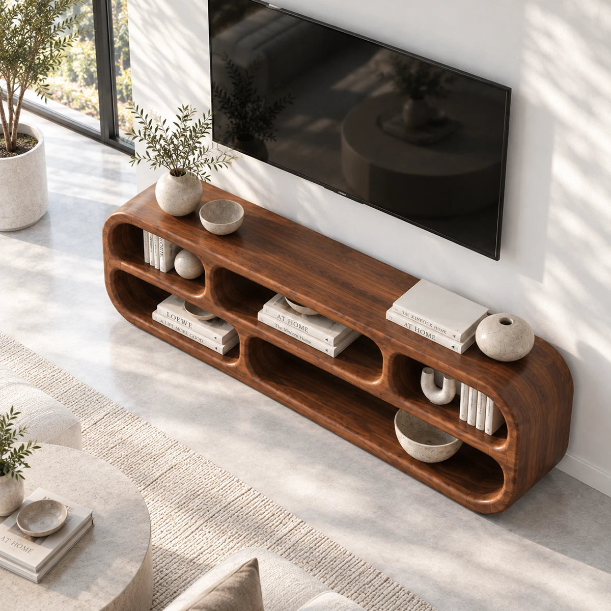 Minimalist TV cabinet in solid wood with organic curves and symmetrical shelving
