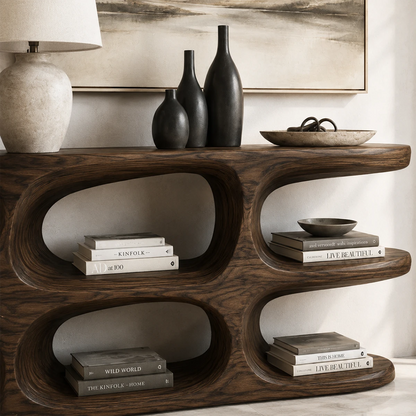 Designer hallway table showcases layered shelving and soft organic architectural lines