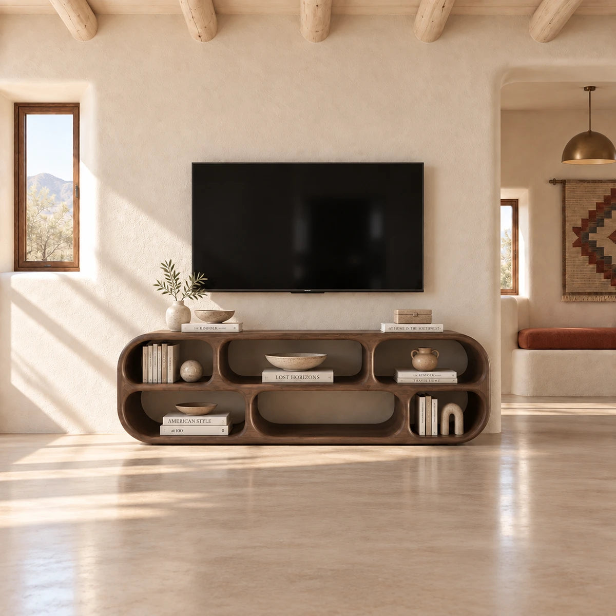 Minimalist media unit in natural solid wood with sculpted curves and open cubbies