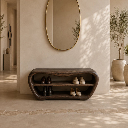 Sculptural entryway bench with curved shoe storage and a rich dark wood tone finish