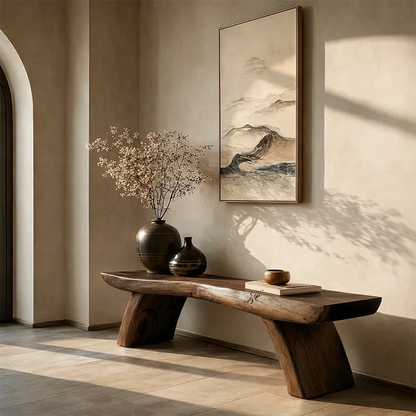 Functional entry bench designed with sculptural base form and warm walnut tone finish