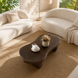 Modern coffee table with visible grain and deep wood tone finish in a serene lounge