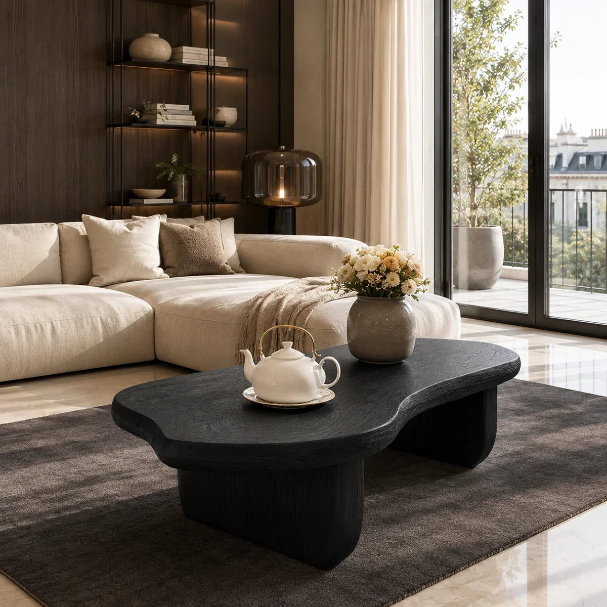 Luxury coffee table with soft edges and low sculpted supports in a bright coastal space