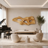 Abstract wall sculpture with organic cutouts creates a bold focal point in modern rooms