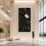 Natural solid wood wall art with sculpted relief adds depth to a tall contemporary wall