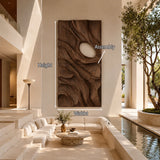 Contemporary wall sculpture with organic carving creates a distinctive home centerpiece
