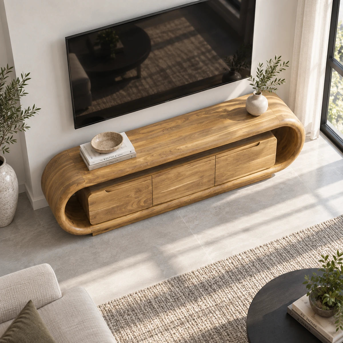 Minimalist media cabinet in solid wood with rounded corners and hidden storage space

