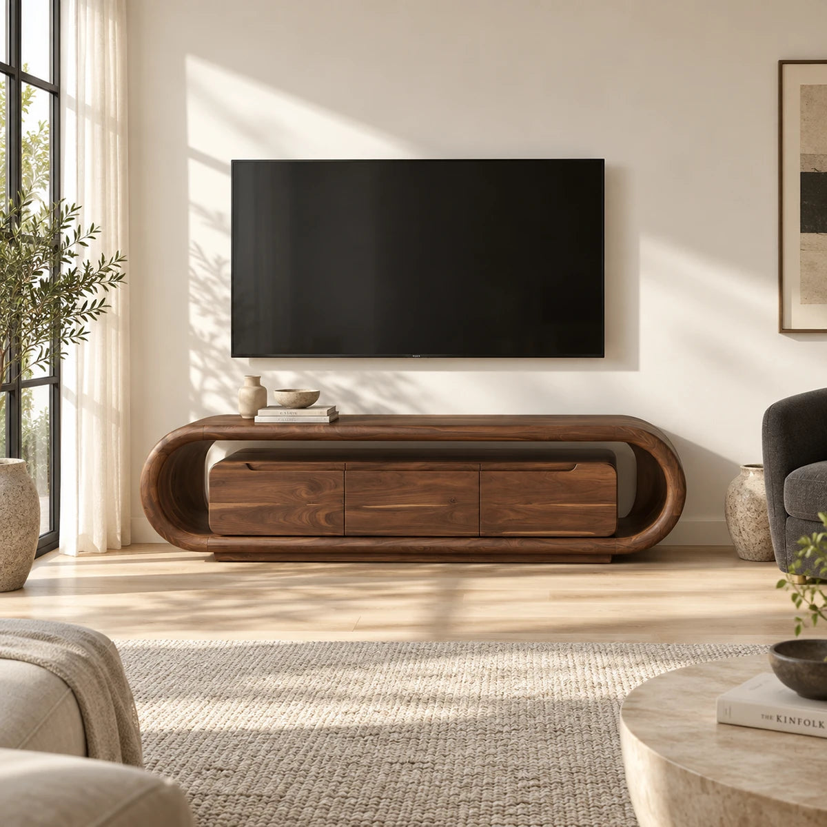 Designer entertainment unit in solid wood with curved ends and three panel doors
