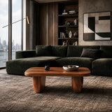Rounded coffee table designed with bold proportions and rich wood tone appeal indoors