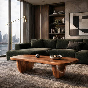 Modern coffee table with oval top and warm wood tone finish in a refined living room