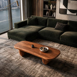 Organic modern coffee table adds sculptural character to an upscale apartment interior