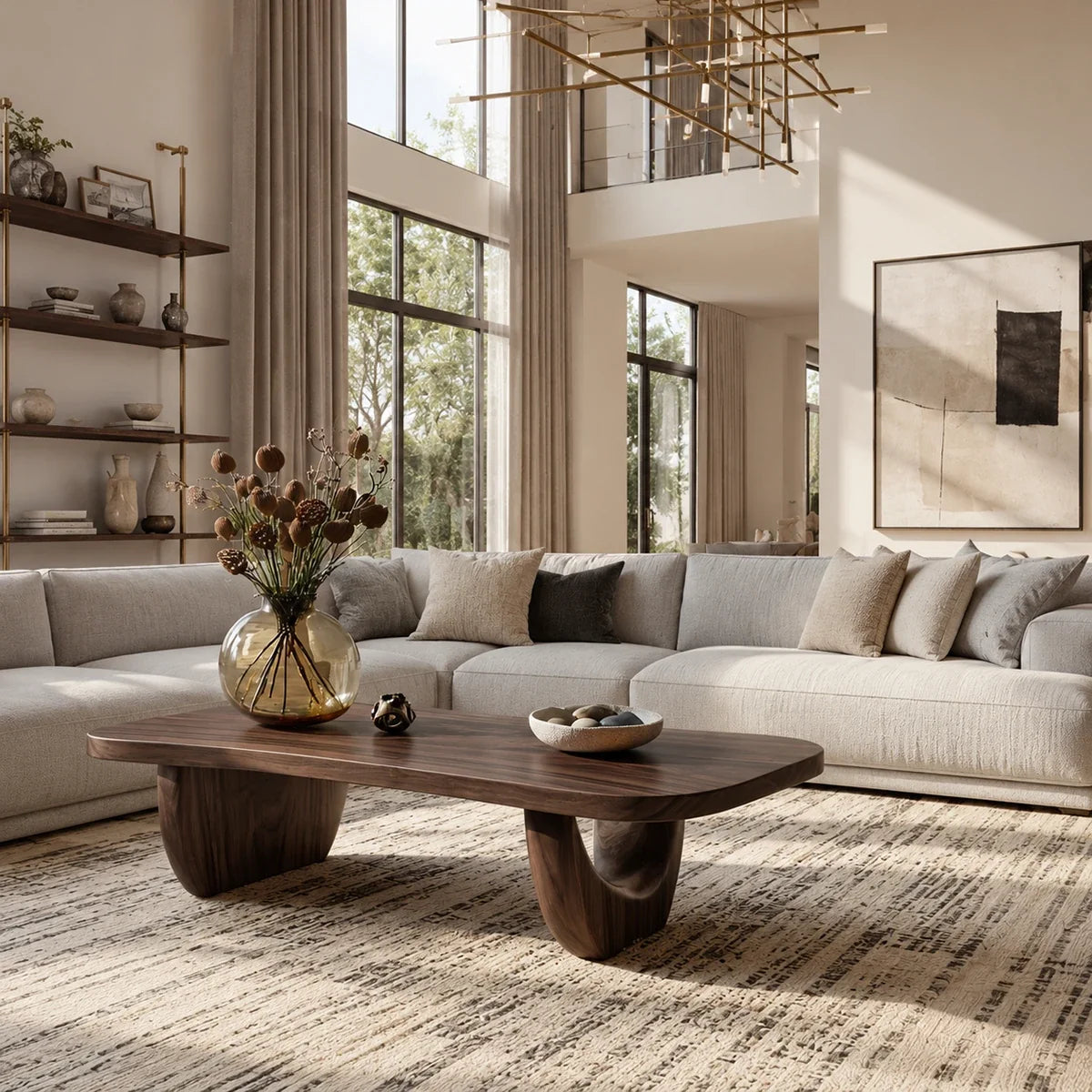 Contemporary coffee table with sleek curves and sturdy pedestal legs in a loft interior