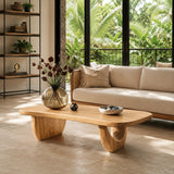 Statement coffee table with elongated top and warm wood tone in a chic lounge space