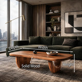Living room coffee table with a smooth oval top and sculpted base for daily use