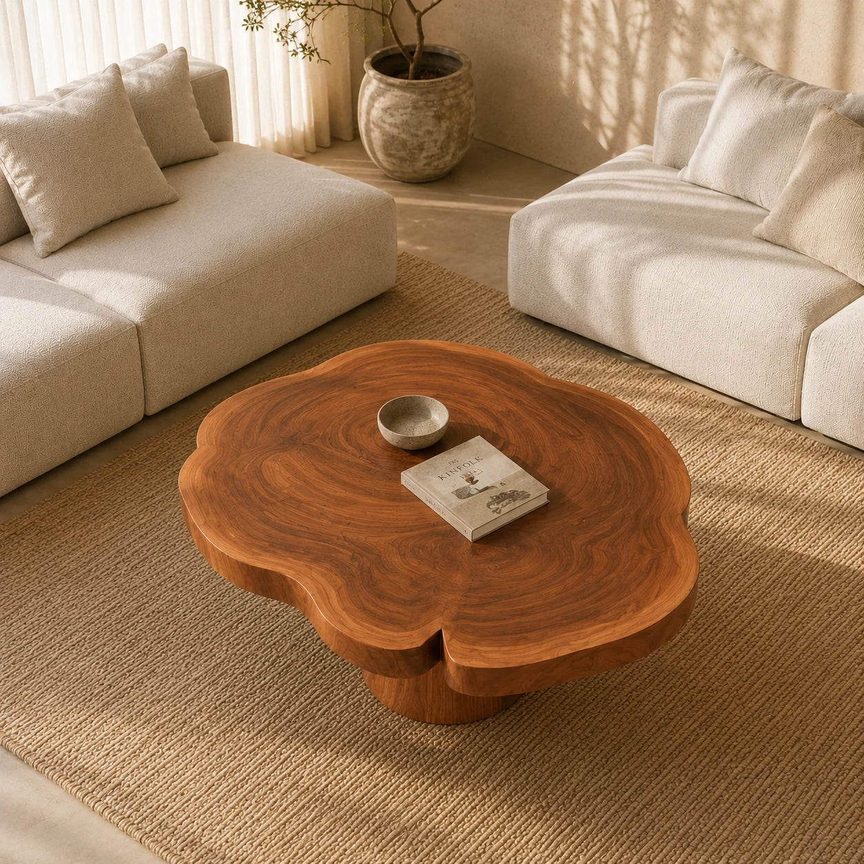 A solid wood coffee table with floral curves and a pedestal base for cozy spaces