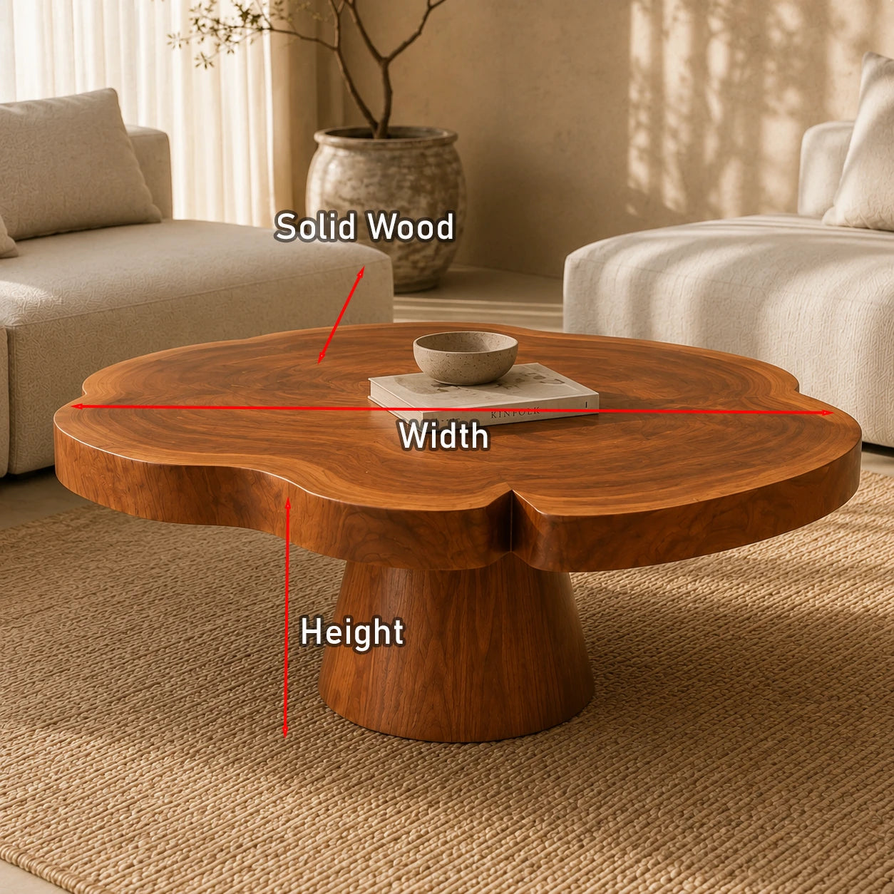 Minimalist coffee table with a rounded silhouette and sturdy central pedestal base