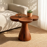 Curved side table adds sculptural character and practical surface to serene home interiors