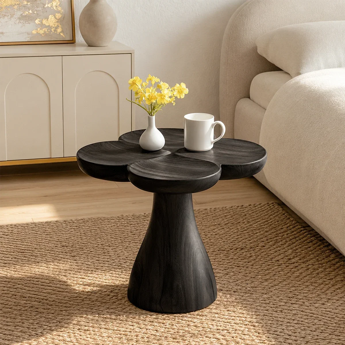 Luxury side table with organic top and sculpted pedestal base in an airy living interior
