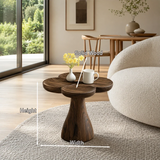 Contemporary end table showcases soft curves and rich wood tone in a calm modern room