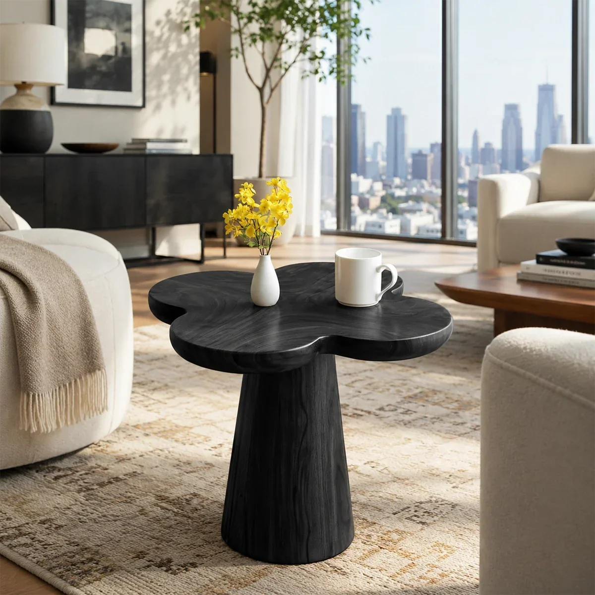 Luxury side table with rounded organic top and sculpted support in a bright interior
