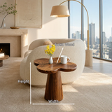Contemporary end table showcases soft curves and warm wood tone in an airy city room