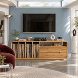 A rounded media cabinet in solid wood with record storage and open display shelf
