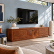 Solid wood TV stand with carved ripple doors and framed center cabinet storage space
