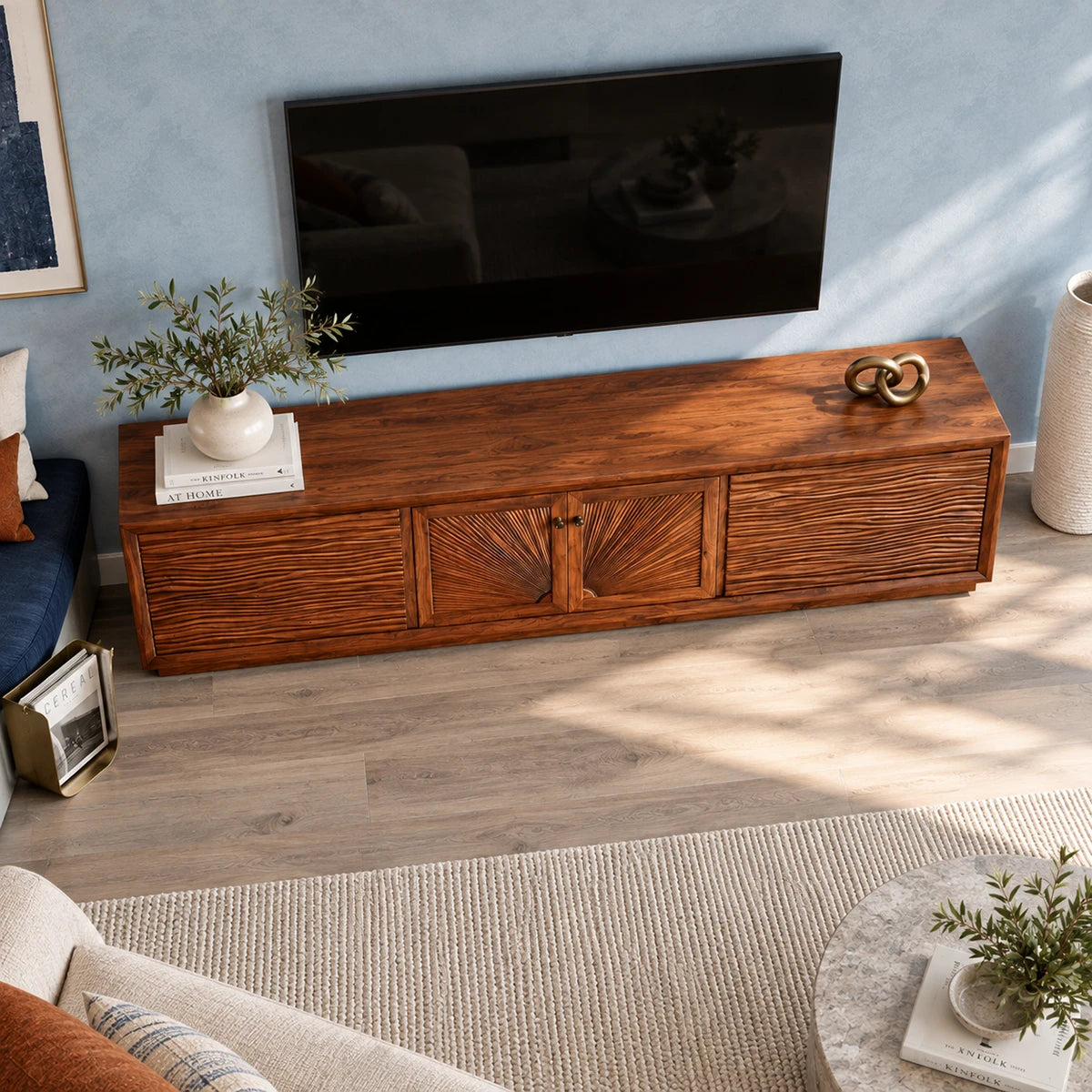 Minimalist TV cabinet in solid wood with artistic door carving and clean framing
